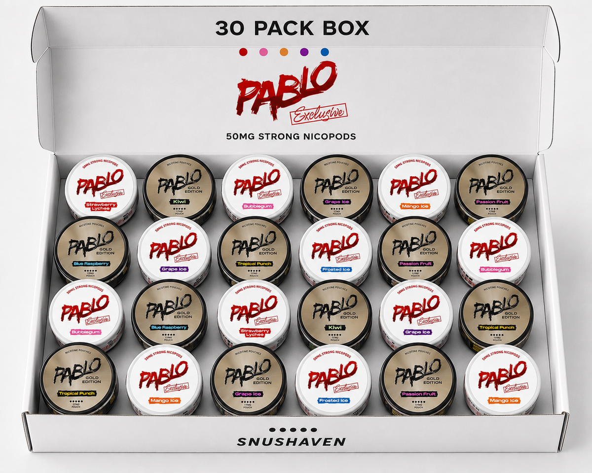 An open white Pablo Exclusives 30-pack box containing 30 small jars of strong nicotine pods, arranged in five rows of six. The top of the box reads '30 PACK BOX' and features the red Pablo logo, with 'SNUSHAVEN' printed at the bottom.