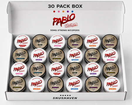 An open white Pablo Exclusives 30-pack box containing 30 small jars of strong nicotine pods, arranged in five rows of six. The top of the box reads '30 PACK BOX' and features the red Pablo logo, with 'SNUSHAVEN' printed at the bottom.